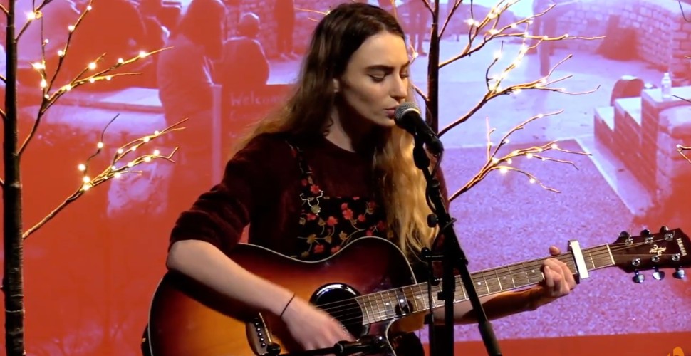 Caitlin Brawn playing guitar 